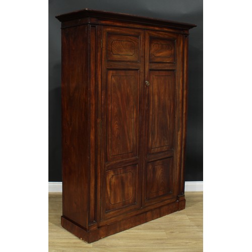 1239 - A George III mahogany wardrobe, possibly Channel Islands, moulded cornice above a pair of panel door... 