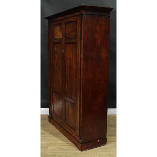 1239 - A George III mahogany wardrobe, possibly Channel Islands, moulded cornice above a pair of panel door... 