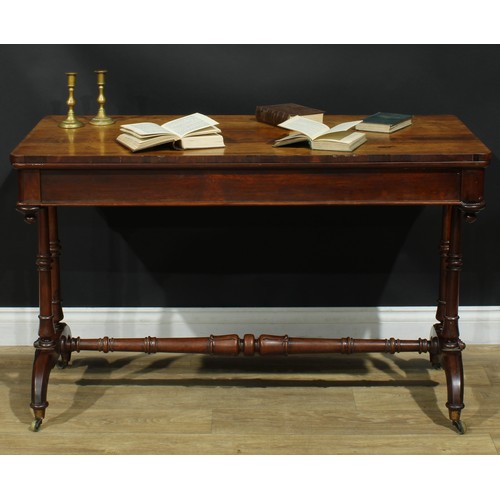 1275 - A George/William IV rosewood library table, rounded rectangular top above a long frieze drawer, turn... 