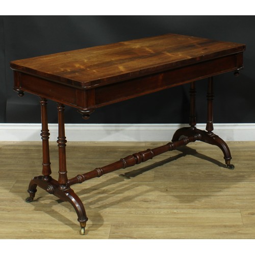 1275 - A George/William IV rosewood library table, rounded rectangular top above a long frieze drawer, turn... 