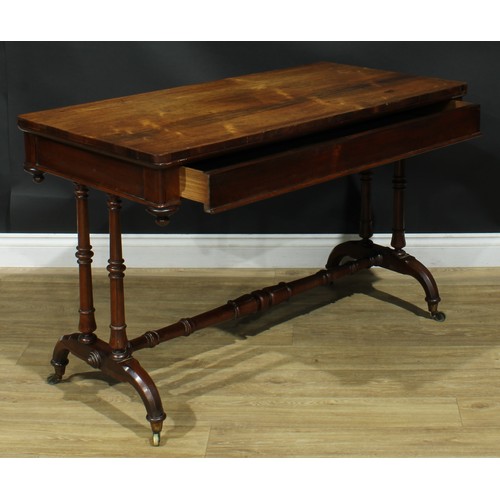 1275 - A George/William IV rosewood library table, rounded rectangular top above a long frieze drawer, turn... 