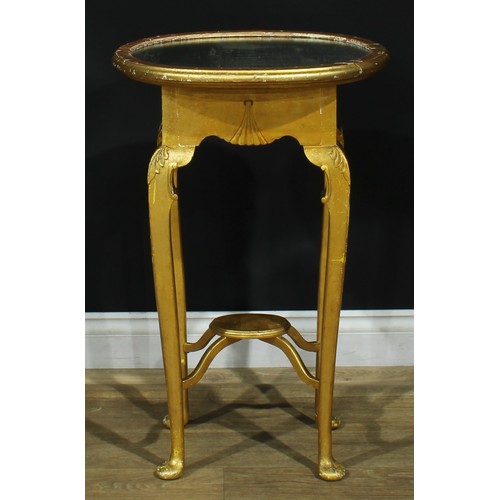 1094 - A George II Revival giltwood occasional table, oval top with mirror plateau, shaped apron, straighte... 