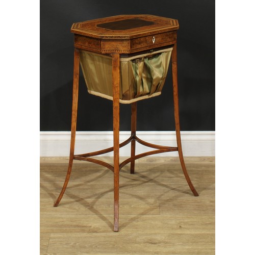 891 - A 19th century burr yew and parquetry work table, hinged top with dogtooth border above a basket und... 