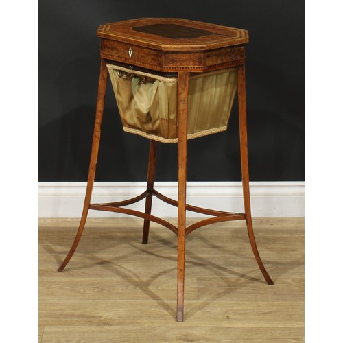 891 - A 19th century burr yew and parquetry work table, hinged top with dogtooth border above a basket und... 