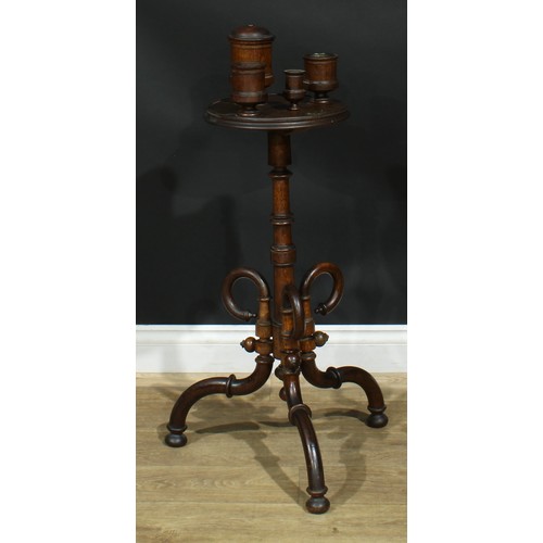 947 - A 19th century oak smoking stand, circular plateau with turned vessels, turned column, downswept leg... 