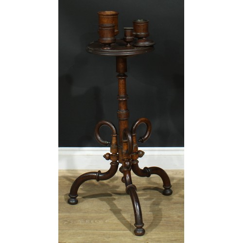 947 - A 19th century oak smoking stand, circular plateau with turned vessels, turned column, downswept leg... 