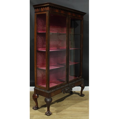 1282 - A large Chippendale Revival mahogany display cabinet, Greek key cornice above a flame veneered friez... 