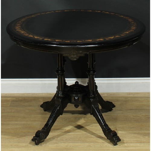 1329 - A late Victorian Aesthetic Movement ebonised and marquetry centre table, oval tilting top inlaid wit... 