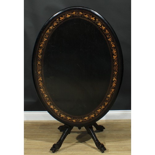 1329 - A late Victorian Aesthetic Movement ebonised and marquetry centre table, oval tilting top inlaid wit... 