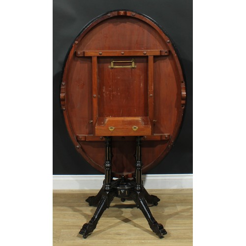 1329 - A late Victorian Aesthetic Movement ebonised and marquetry centre table, oval tilting top inlaid wit... 