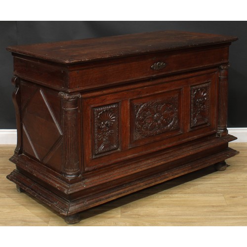 1293 - A late 17th/early 18th century Continental oak chest, hinged top above a three panel front, carved w... 