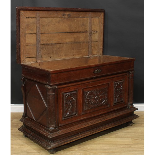 1293 - A late 17th/early 18th century Continental oak chest, hinged top above a three panel front, carved w... 