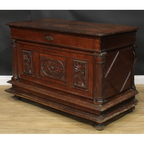 1293 - A late 17th/early 18th century Continental oak chest, hinged top above a three panel front, carved w... 