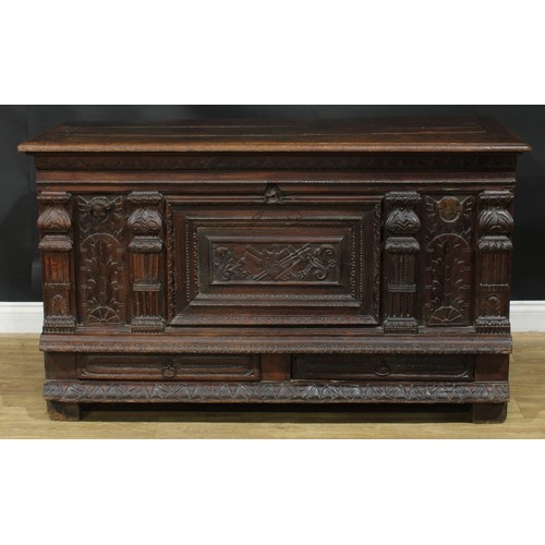 1294 - A late 17th/early 18th century Continental oak mule chest, hinged top enclosing a till, the front ca... 