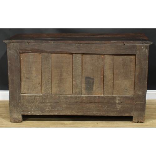 1294 - A late 17th/early 18th century Continental oak mule chest, hinged top enclosing a till, the front ca... 