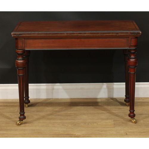 950 - A 19th century parcel-ebonised mahogany card table, hinged top enclosing a baize lined playing surfa... 