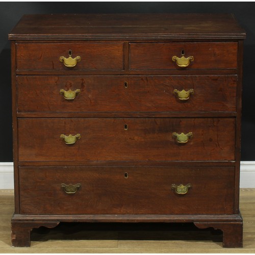 1244 - A George III oak chest, rectangular top with reeded edge above two short and three long graduated dr... 