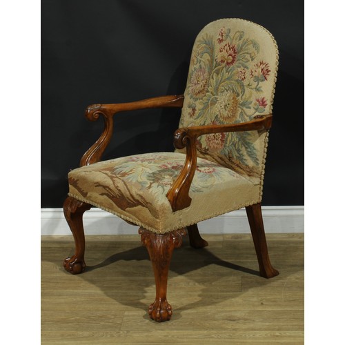 1059 - A George I design walnut open armchair, stuffed-over upholstery, scroll hand rests carved with a she... 