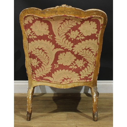 1351 - A Louis XV Revival giltwood fauteuil, in the manner of Blaise Maucuy, stuffed-over upholstery, cabri... 