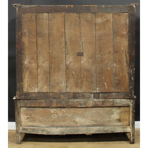 1162 - A George III oak housekeeper’s provision or livery press cupboard, outswept cornice above a pair of ... 