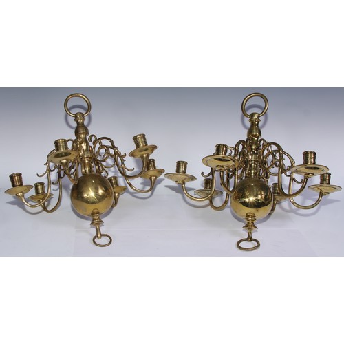 1018 - A near pair of Dutch brass six-light chandeliers, 45cm high, 46cm wide