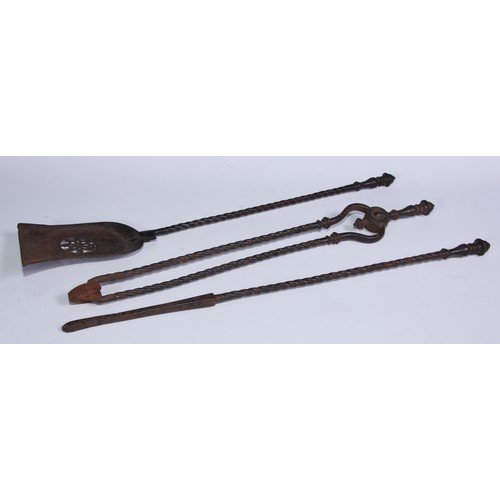 1253 - A George III steel fireside companion set, comprising shovel, poker and tongs, the shovel 63.5cm lon... 