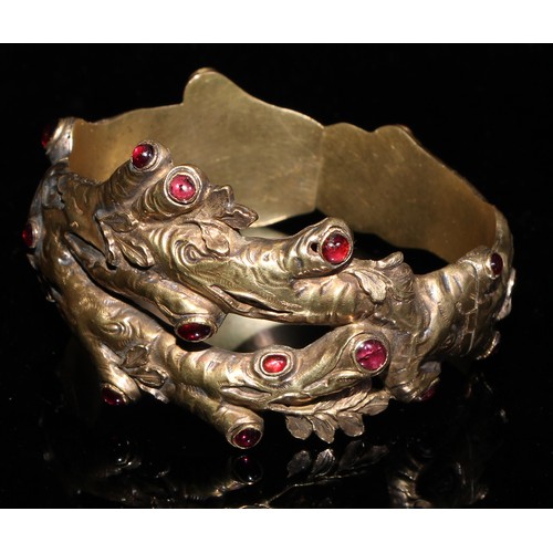 362 - A Victorian hinged bangle, naturalistically formed as oak branches and set with red hardstone caboch... 