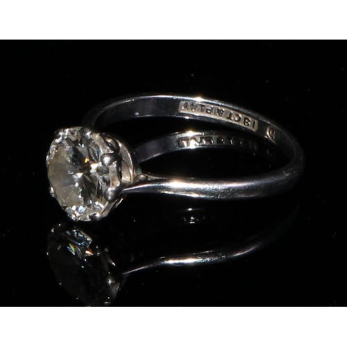 344 - A diamond solitaire ring, 18ct white gold and platinum, the brilliant cut stone claw set, size N/O, ... 