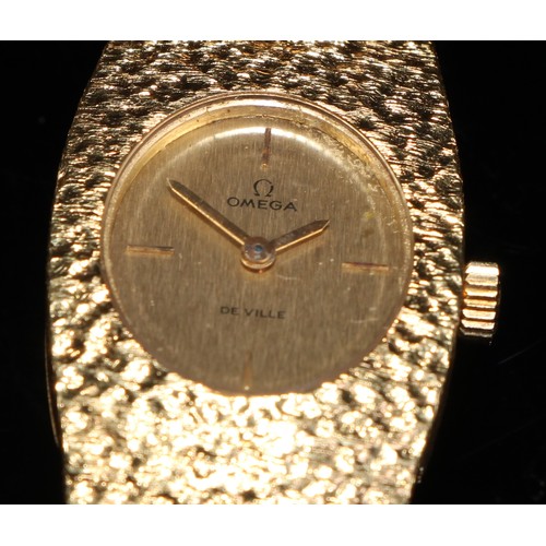 336 - An 18ct gold lady's Omega De Ville wristwatch, gold foil dial, baton markers at the quarters, integr... 