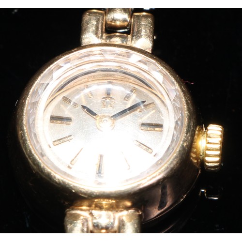 327 - A 9ct gold lady's Omega cocktail wristwatch, silvered dial, baton markers, articulated strap, 16g gr... 