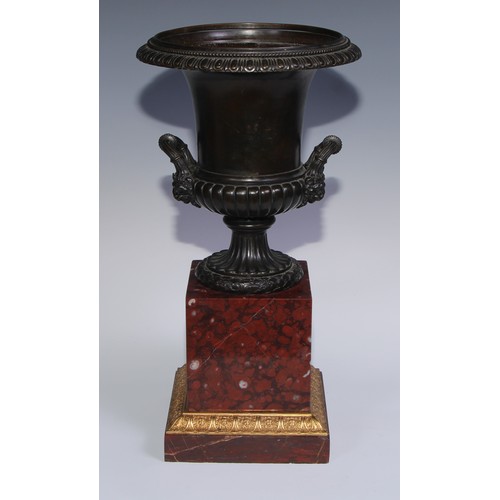 1267 - A pair of 19th century brown patinated bronze half-fluted campana urns, everted egg-and-dart rims, w... 