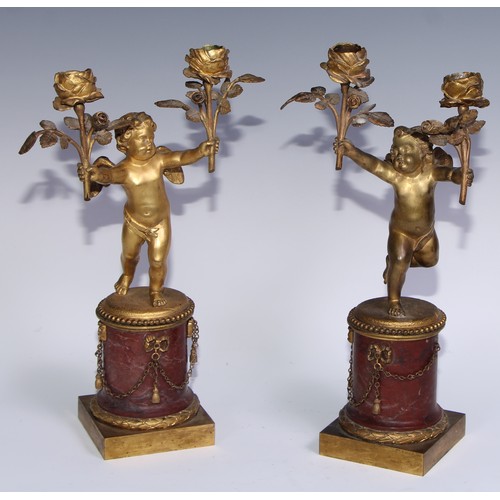 1385 - A pair of 19th century gilt bronze and rosso antico marble two-light figural mantel candelabra, each... 