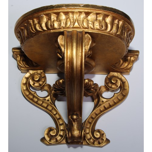 1386 - A pair of 19th century giltwood and gesso wall brackets, bowed plateau with acanthus border, above a... 