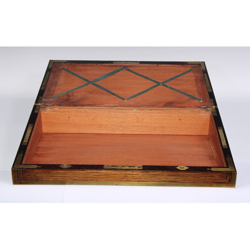 1257 - A large Regency rosewood rectangular campaign writing box, the hinged cover ratchet-adjustable for r... 