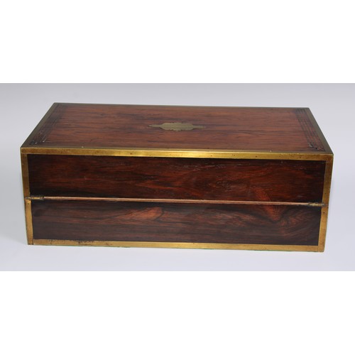 1257 - A large Regency rosewood rectangular campaign writing box, the hinged cover ratchet-adjustable for r... 