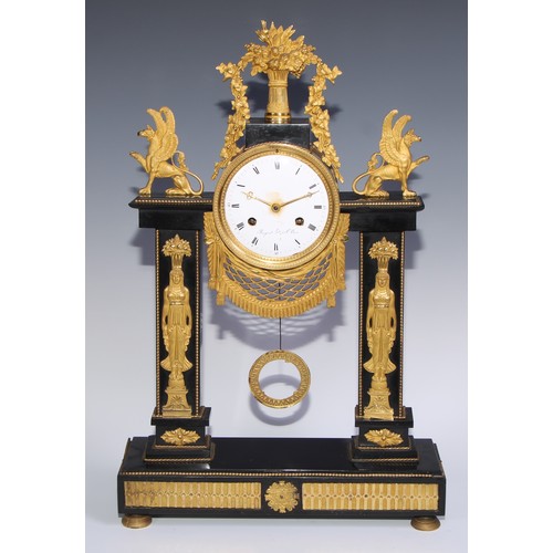 981 - A French Empire gilt bronze mounted black noir marble mantel clock, in the Egyptian Revival taste, 1... 