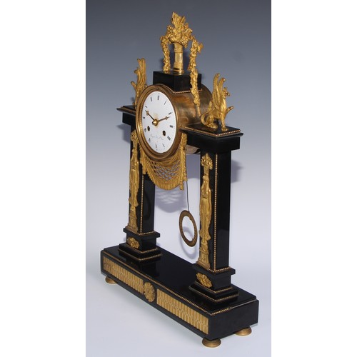 981 - A French Empire gilt bronze mounted black noir marble mantel clock, in the Egyptian Revival taste, 1... 