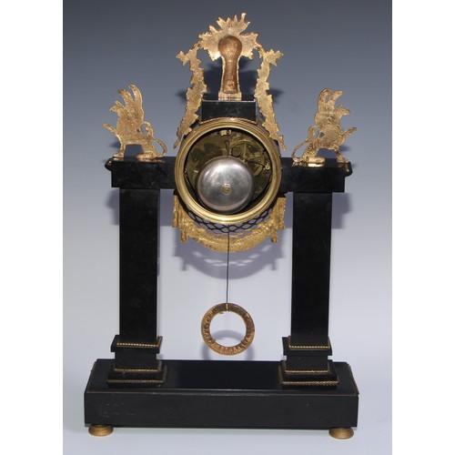 981 - A French Empire gilt bronze mounted black noir marble mantel clock, in the Egyptian Revival taste, 1... 