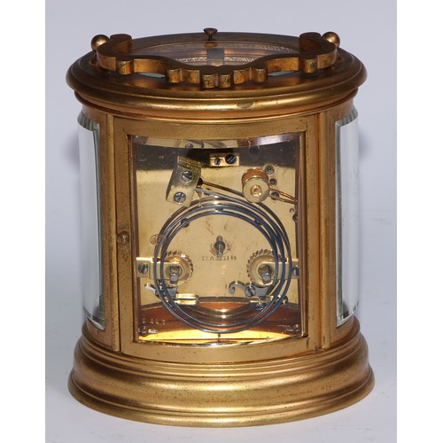 1425 - A late 19th century gilt brass oval repeater carriage clock, 5.5cm enamel dial inscribed with Roman ... 