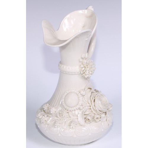 390 - A Belleek ewer, in the white and typically encrusted with flowers, 23.5cm high, second mark, c.1891 ... 