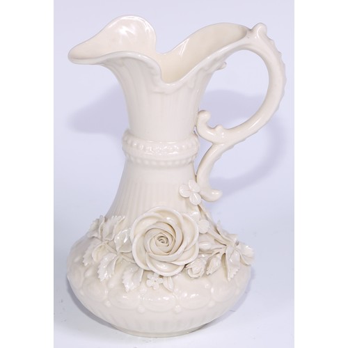 390 - A Belleek ewer, in the white and typically encrusted with flowers, 23.5cm high, second mark, c.1891 ... 