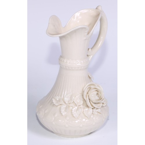 390 - A Belleek ewer, in the white and typically encrusted with flowers, 23.5cm high, second mark, c.1891 ... 