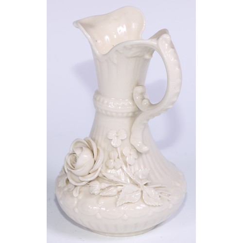 390 - A Belleek ewer, in the white and typically encrusted with flowers, 23.5cm high, second mark, c.1891 ... 