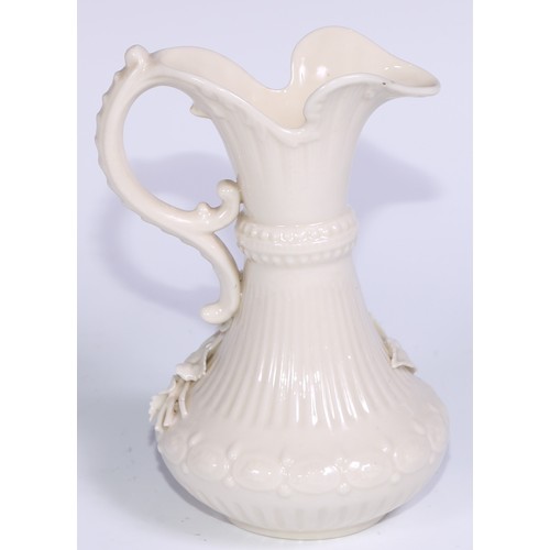 390 - A Belleek ewer, in the white and typically encrusted with flowers, 23.5cm high, second mark, c.1891 ... 