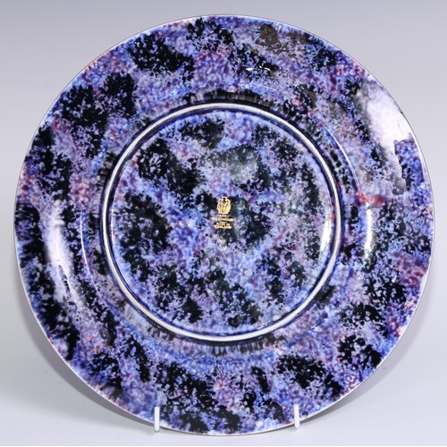 391 - A Wedgwood Fairly Land Lustre Roc Centre Imps on a Bridge Lincoln plate, designed by Daisy Makeig-Jo... 