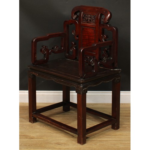 1025 - A Chinese hardwood armchair, shaped back carved with scrolls and set with a panel pierced and carved... 