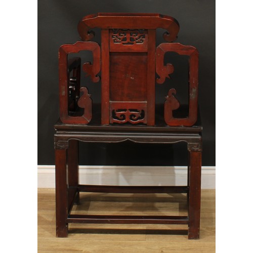 1025 - A Chinese hardwood armchair, shaped back carved with scrolls and set with a panel pierced and carved... 