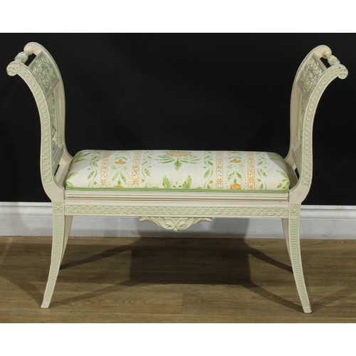 1363 - A Louis XVI style painted window seat, the ends carved with a flowering urn, ribbon-tied swags and a... 