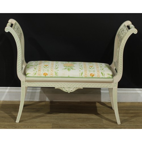 1363 - A Louis XVI style painted window seat, the ends carved with a flowering urn, ribbon-tied swags and a... 