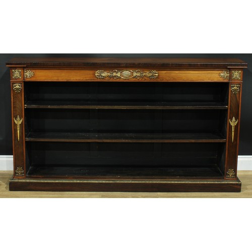 1419 - A Regency gilt metal mounted rosewood open library bookcase, oversailing top outlined with brass str... 